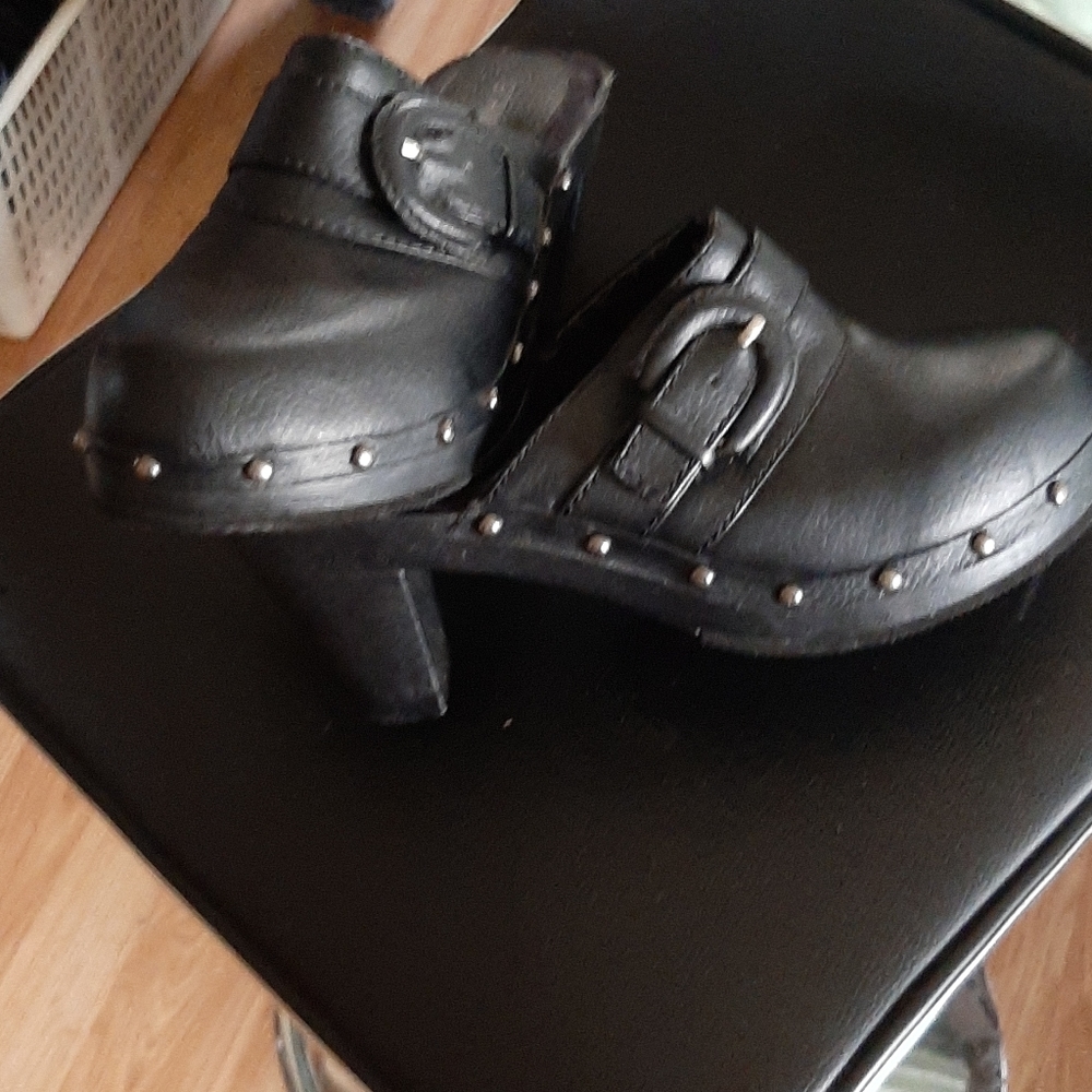 Black leather studded clogs